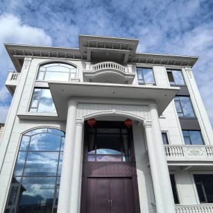 青海白麻别墅外墙干挂石材效果示例